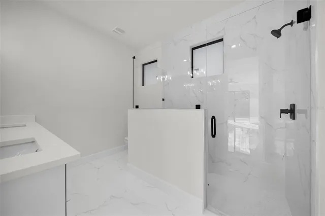 a view of a bathroom with a shower