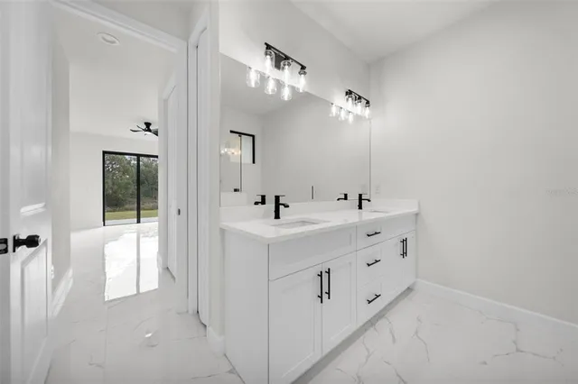 a bathroom with a double vanity sink and mirror