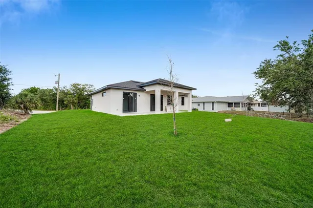 a view of a house with a big yard