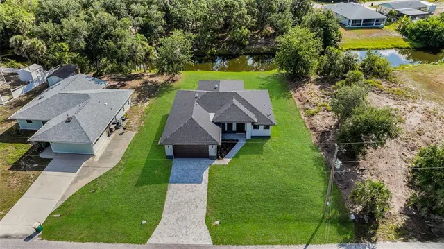 an aerial view of a house with a garden