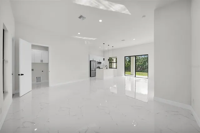 a view of an empty room with glass door