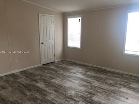 22884 Dolphin Road, Unit B Boca Raton, FL 33428 - Photo 10 of 14 an empty room with a window