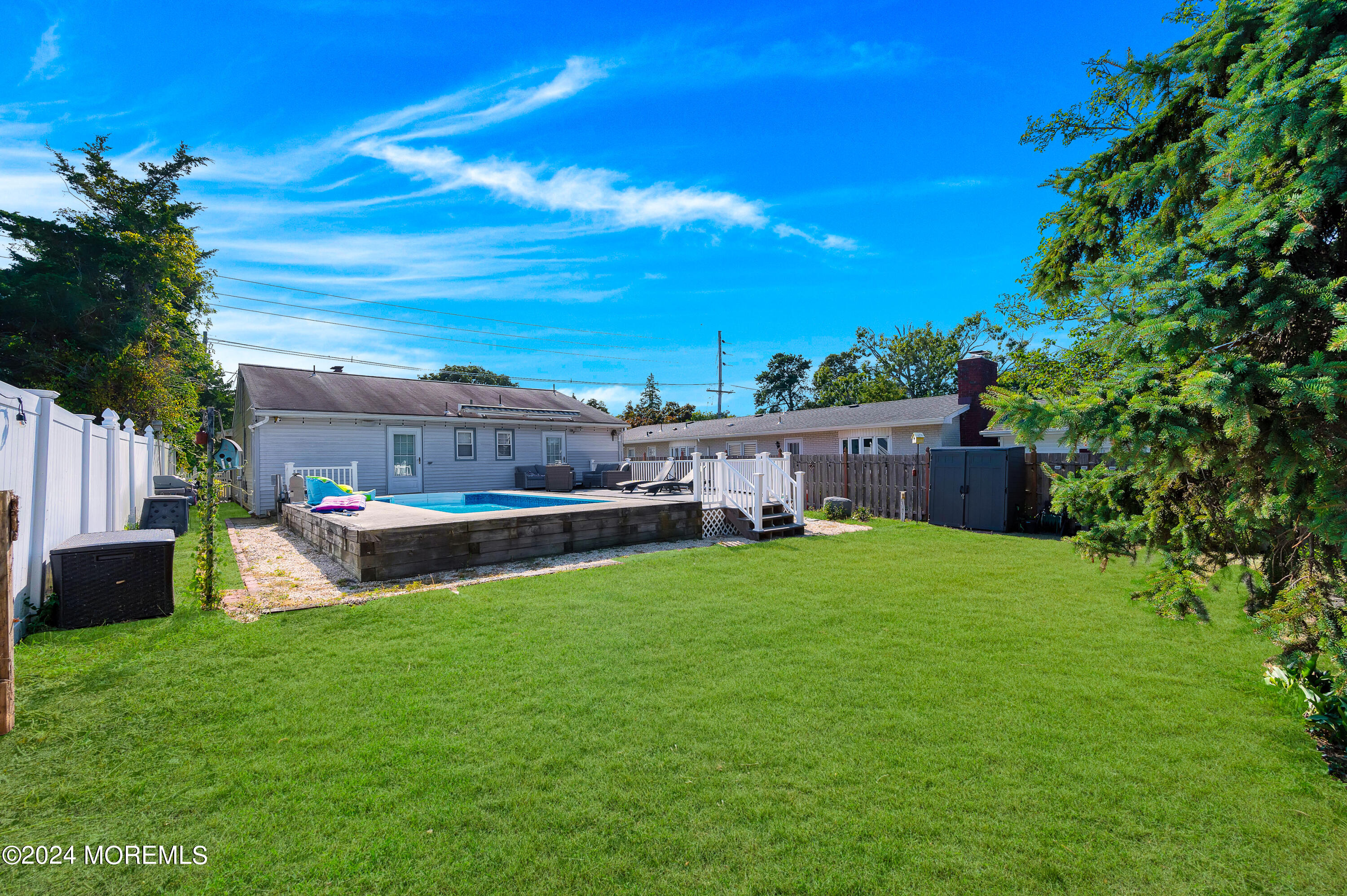 3503 River Road Point Pleasant, NJ 08742 - Photo 8 of 21 a view of yard with swimming pool and green space