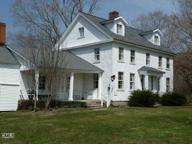 1 Anderson Acres Road Kent, CT 06785 - Photo 1 of 1 a front view of a house with a garden
