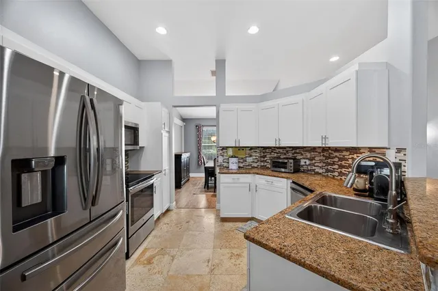 a kitchen with a stove and a microwave