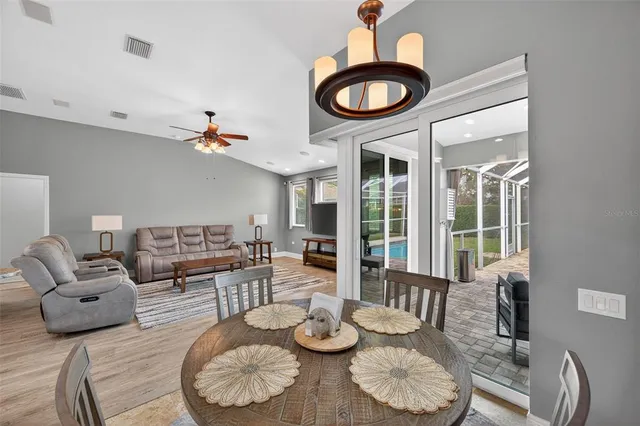 a dining room with furniture and window