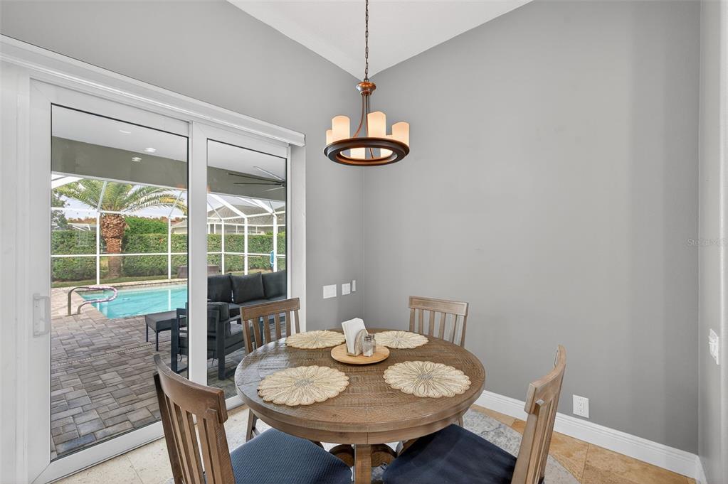 10539 Gooseberry Court Trinity, FL 34655 - Photo 14 of 52 a dining room with furniture and window