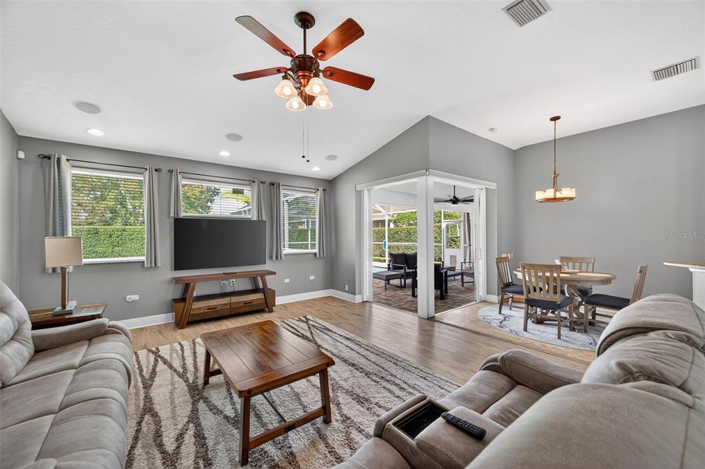 10539 Gooseberry Court Trinity, FL 34655 - Photo 15 of 52 a living room with furniture and a flat screen tv