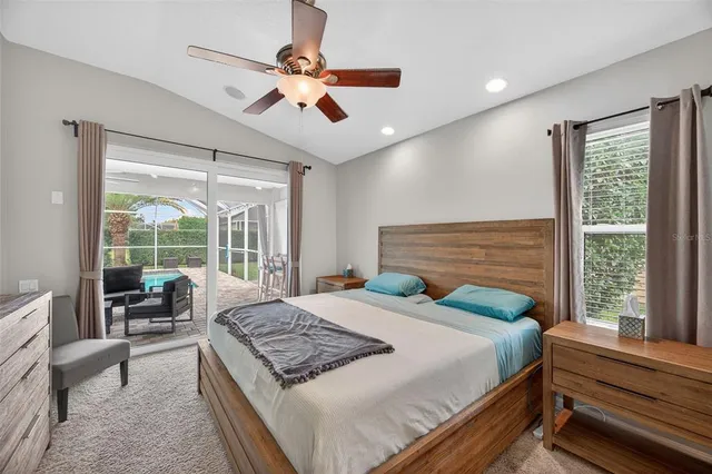 a bed room with a bed and a chandelier