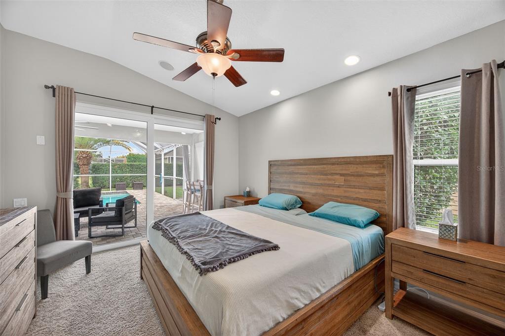 10539 Gooseberry Court Trinity, FL 34655 - Photo 16 of 52 a bedroom with a large bed and a large window