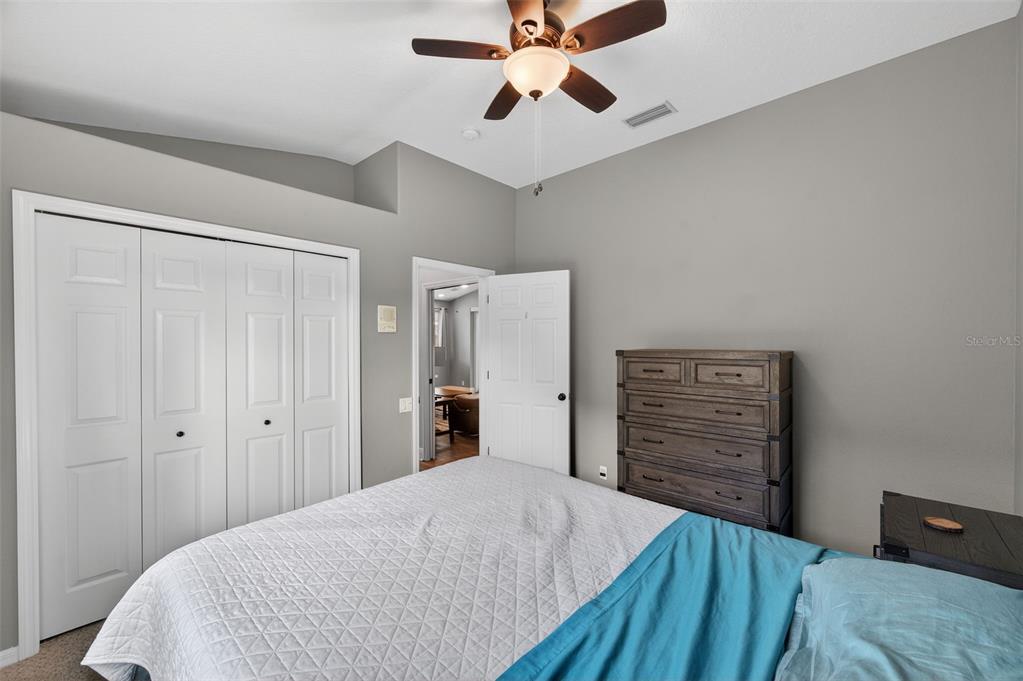 10539 Gooseberry Court Trinity, FL 34655 - Photo 23 of 52 a bedroom with a bed and a dresser