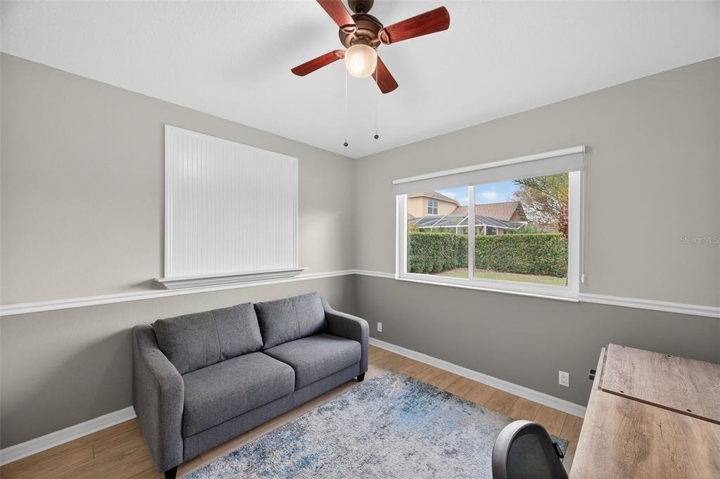 10539 Gooseberry Court Trinity, FL 34655 - Photo 26 of 52 a living room with furniture and a window