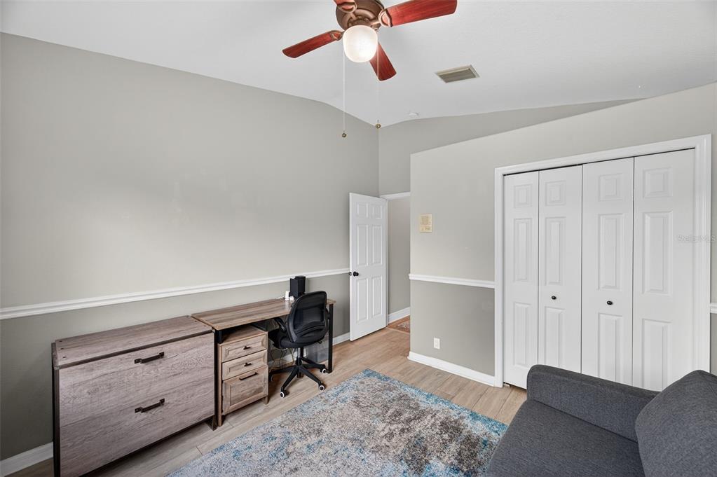 10539 Gooseberry Court Trinity, FL 34655 - Photo 27 of 52 a living room with furniture and a ceiling fan