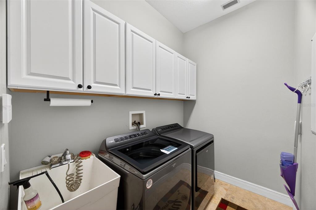 10539 Gooseberry Court Trinity, FL 34655 - Photo 28 of 52 a utility room with dryer washer and sink