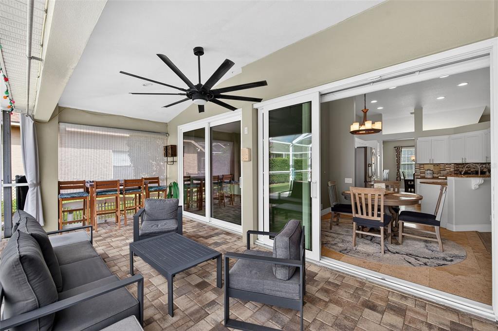 10539 Gooseberry Court Trinity, FL 34655 - Photo 29 of 52 a living room with furniture a flat screen tv and a large window
