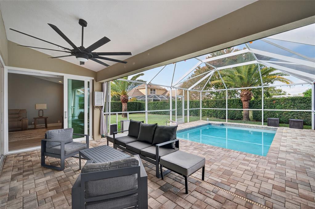 10539 Gooseberry Court Trinity, FL 34655 - Photo 31 of 52 a living room with furniture and a large window
