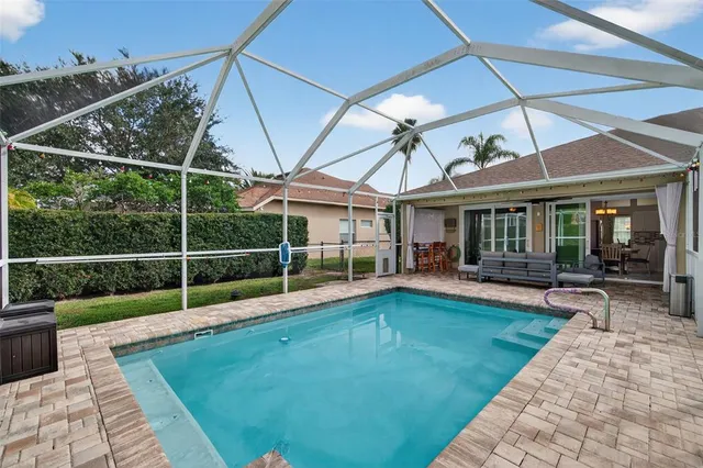 a view of a backyard with a swimming pool