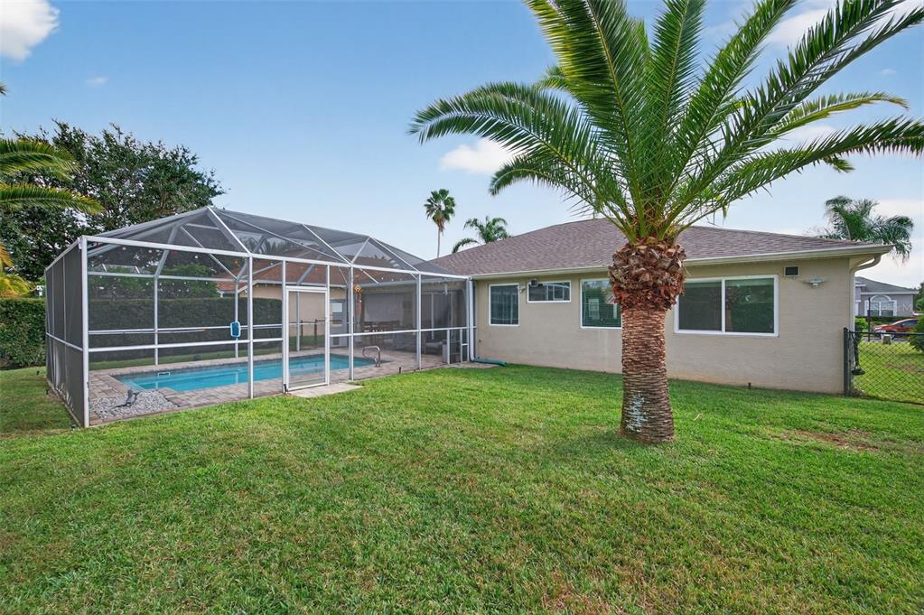 10539 Gooseberry Court Trinity, FL 34655 - Photo 36 of 52 a view of a house with a yard and potted plants with large tree