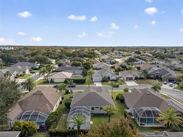 an aerial view of a house with a garden