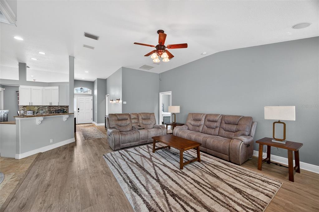 10539 Gooseberry Court Trinity, FL 34655 - Photo 9 of 52 a living room with furniture and kitchen view
