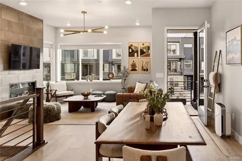 a living room with furniture fireplace and flat screen tv