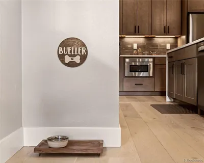 a hallway with rack and dryer