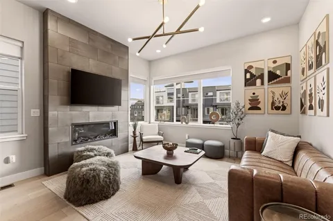 a living room with furniture fireplace and a flat screen tv