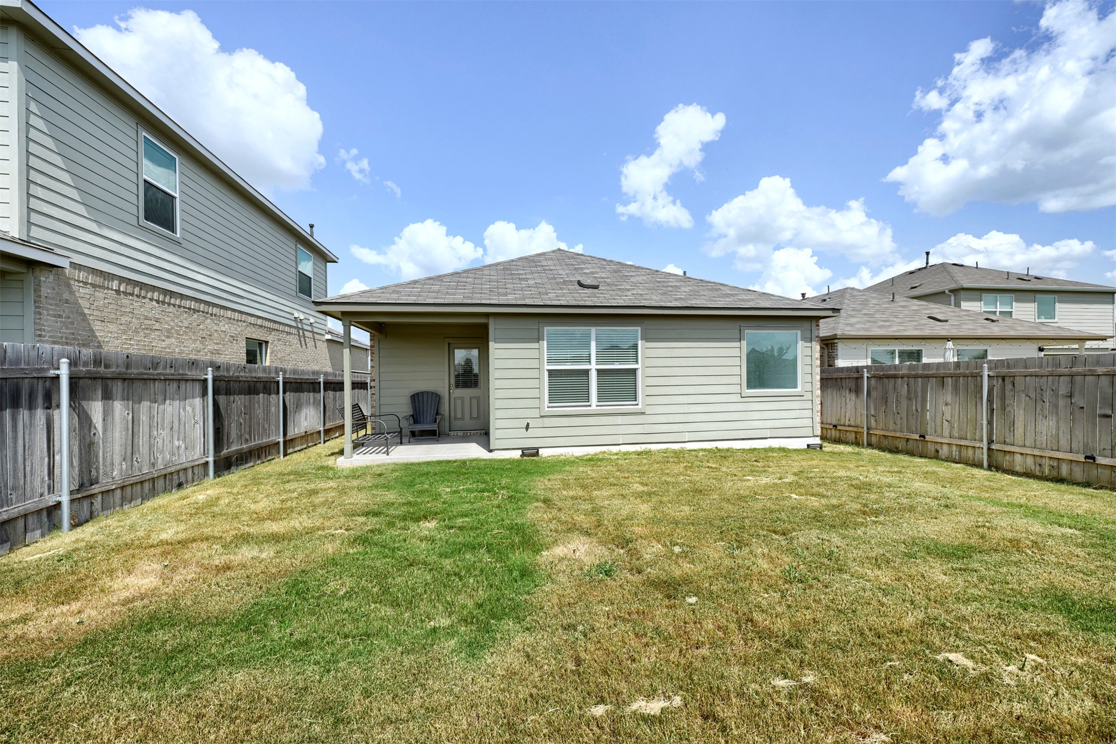 120 Milliner Loop Hutto, TX 78634 - Photo 12 of 15 A spacious backyard with a private fence, ideal for outdoor relaxation and entertainment.