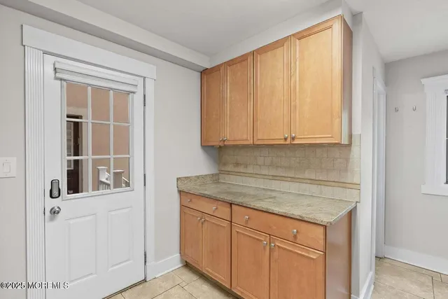 a view of a kitchen cabinets and window