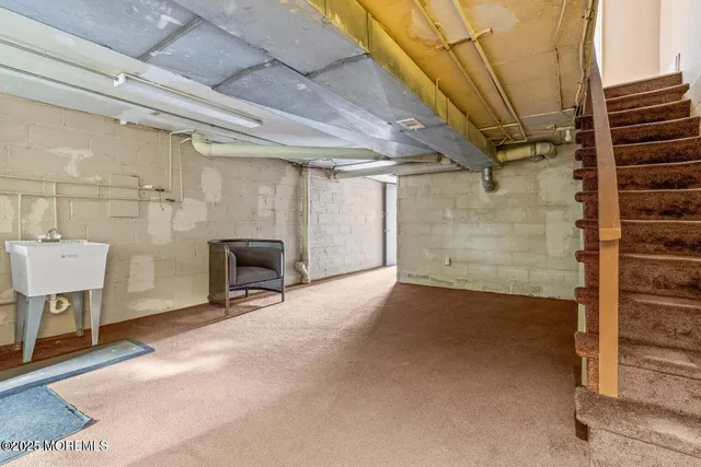 a view of a patio with table and chairs