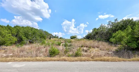 a view of a lake and a yard