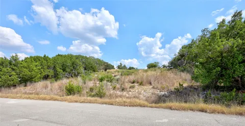 a view of a lake and a yard