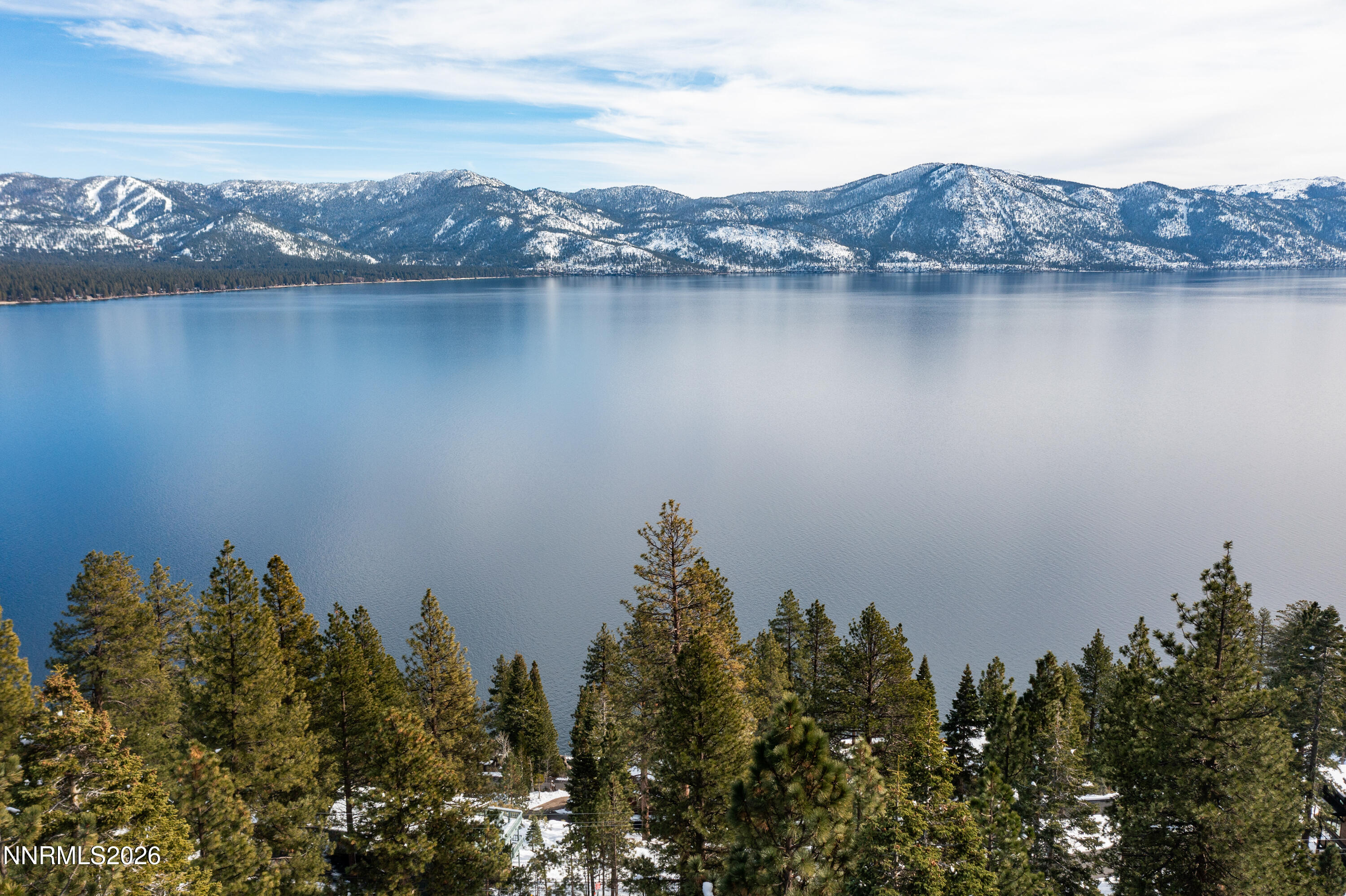 232 Wassou Road Crystal Bay, NV 89402 - Photo 4 of 30 a view of a lake with a mountain in the background