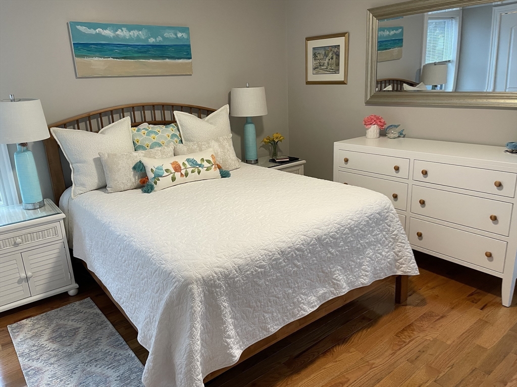 13 High Street, Unit 2 Amesbury, MA 01913 - Photo 15 of 16 a bedroom with a bed and a dresser