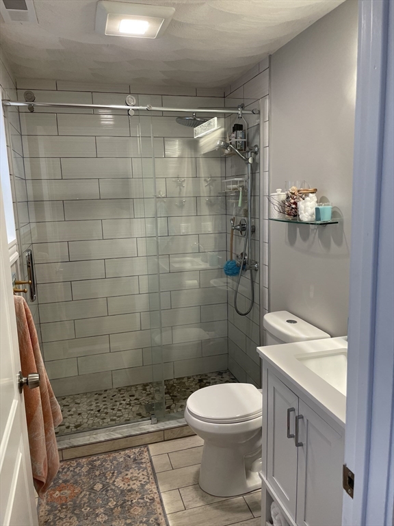 13 High Street, Unit 2 Amesbury, MA 01913 - Photo 16 of 16 a bathroom with a shower a toilet and a sink