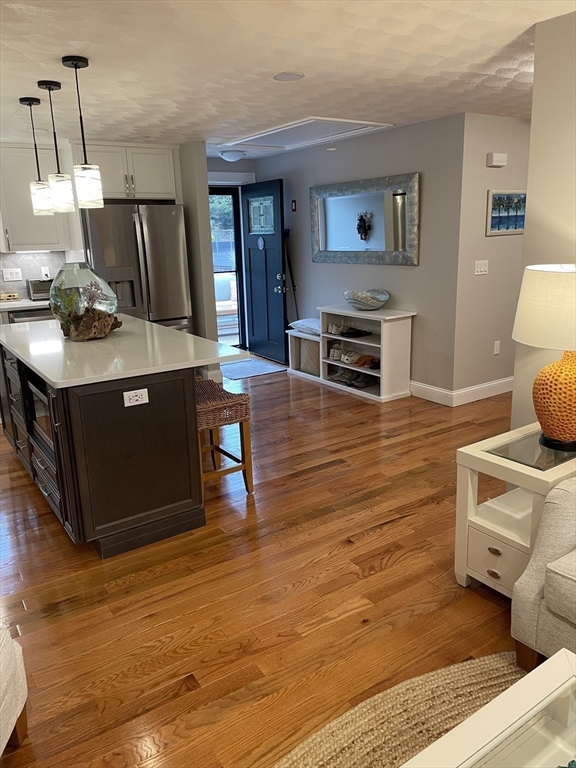13 High Street, Unit 2 Amesbury, MA 01913 - Photo 6 of 16 a living room with furniture and a flat screen tv