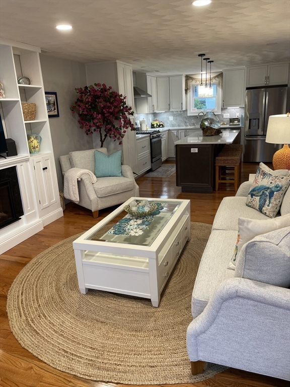 13 High Street, Unit 2 Amesbury, MA 01913 - Photo 10 of 16 a living room with furniture and wooden floor