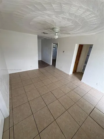 a view of a livingroom and entryway