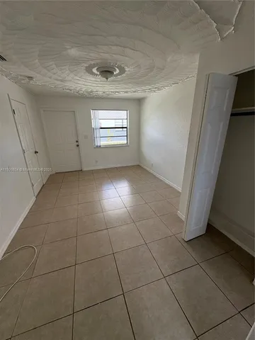 a view of a livingroom and entryway