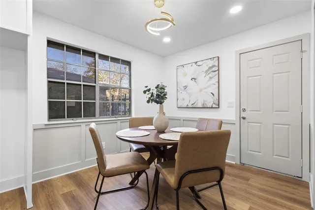 a view of a dining room with furniture window and wooden floor