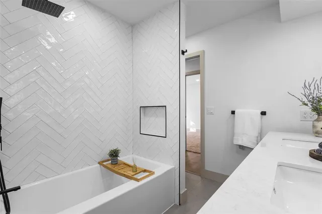 an empty room with windows and ceiling fan