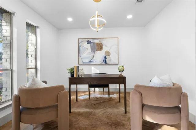 a dining room with furniture and window