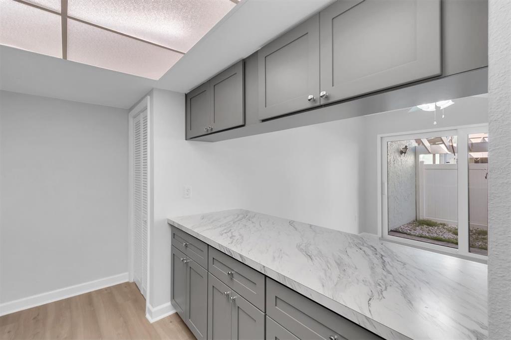 1 Windrush Boulevard, Unit 87 Indian Rocks Beach, FL 33785 - Photo 12 of 54 a view of cabinets and wooden floor