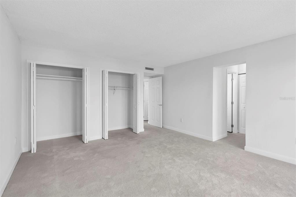 1 Windrush Boulevard, Unit 87 Indian Rocks Beach, FL 33785 - Photo 13 of 54 a view of an empty room and closet area