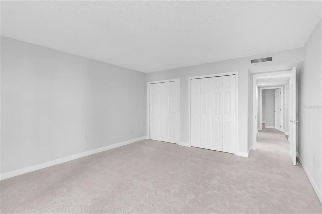 1 Windrush Boulevard, Unit 87 Indian Rocks Beach, FL 33785 - Photo 14 of 54 a view of an empty room and closet area