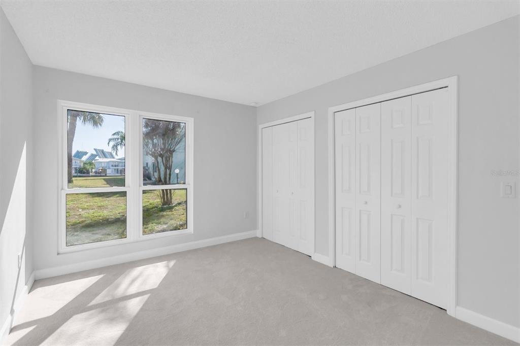 1 Windrush Boulevard, Unit 87 Indian Rocks Beach, FL 33785 - Photo 20 of 54 a view of an empty room with a window