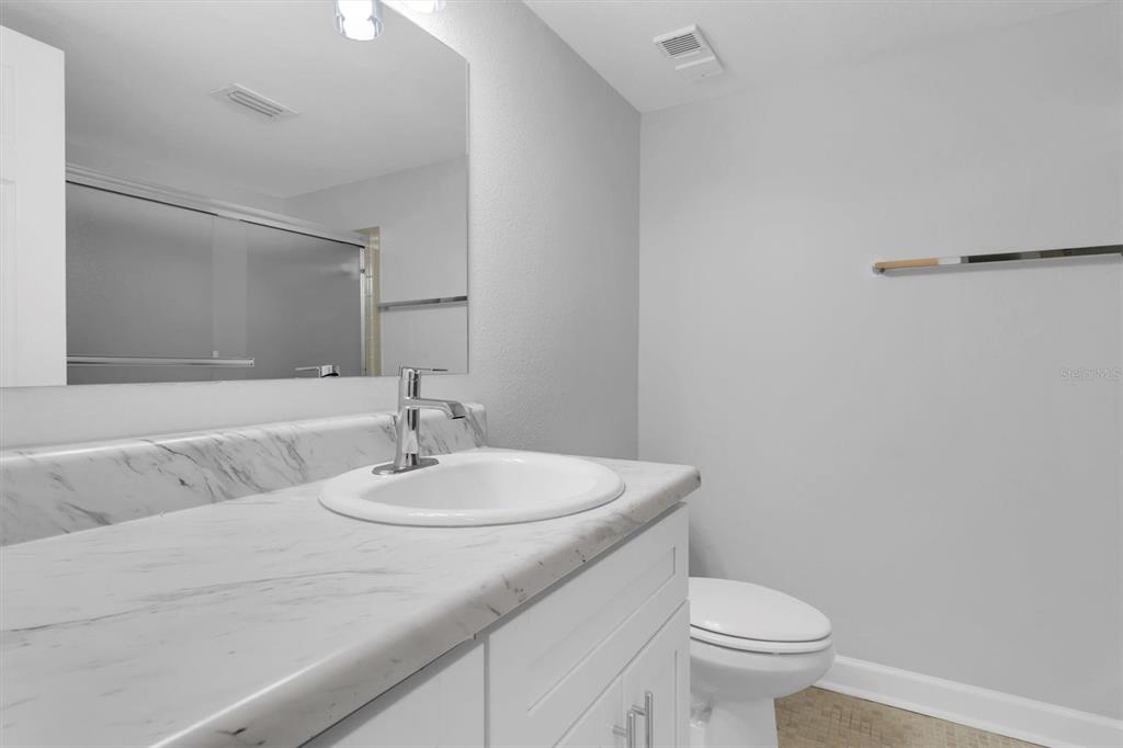 1 Windrush Boulevard, Unit 87 Indian Rocks Beach, FL 33785 - Photo 24 of 54 a bathroom with a sink and a toilet