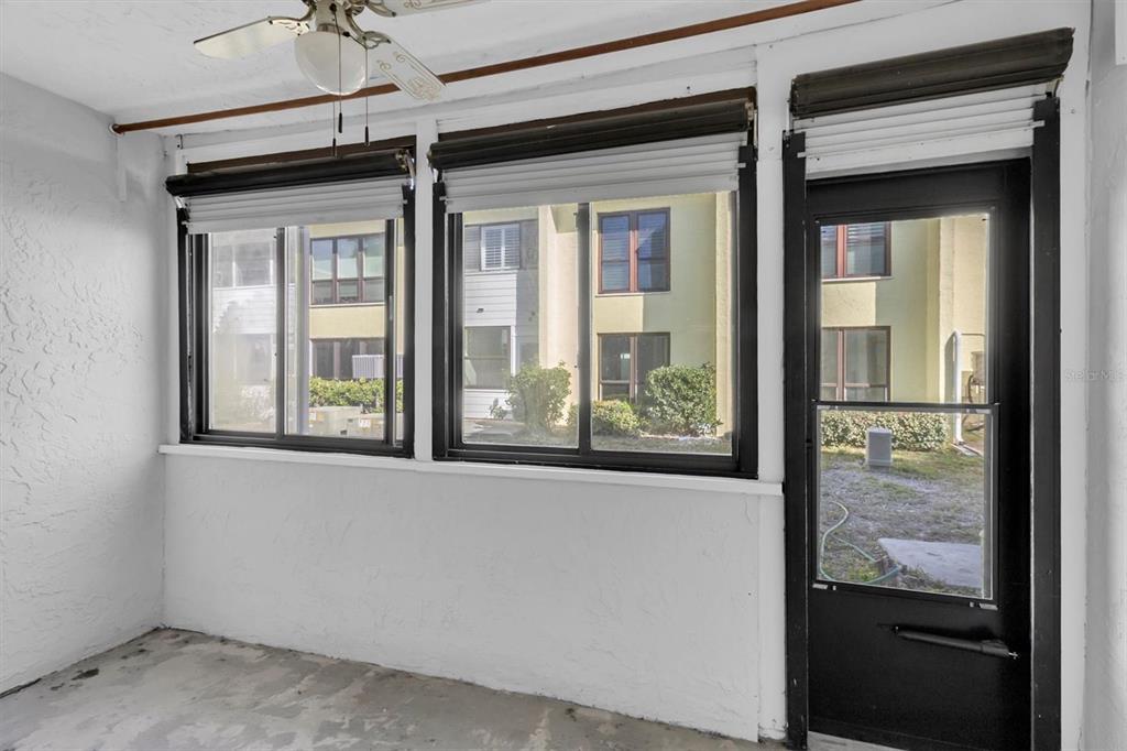 1 Windrush Boulevard, Unit 87 Indian Rocks Beach, FL 33785 - Photo 25 of 54 a view of a door and a window