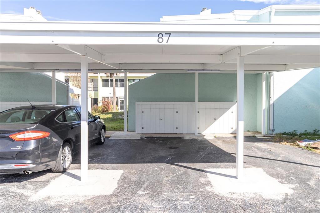 1 Windrush Boulevard, Unit 87 Indian Rocks Beach, FL 33785 - Photo 28 of 54 a view of a garage with a building