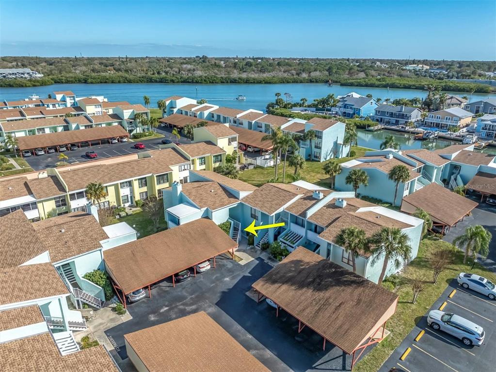 1 Windrush Boulevard, Unit 87 Indian Rocks Beach, FL 33785 - Photo 39 of 54 an aerial view of a balcony with chairs